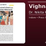 Vighnaharta 2025: Krishna Guruji honours Dr. Nikita Rawal in Indore – newspaper clipping on maroon background.
